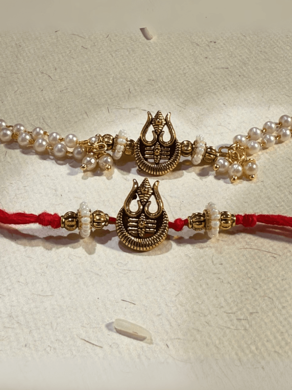 TRINETRA RAKHI & BRACELET (det of two)